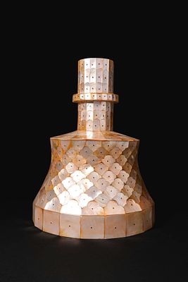 ISLAMIC WOOD AND MOTHER OF PEARL CANDLESTICK. Ca. 19th - 20th century AD. A wood and mother of 