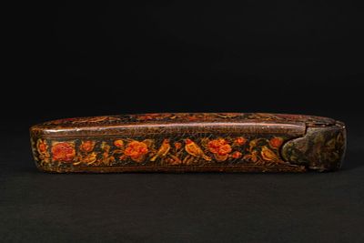 QAJAR LACQUERED PAPIER-M&Acirc;CH&Eacute; PEN CASE (QALAMDAN) AND CALLIGRAPHER'S IMPLEMENTS. Ca. 19th - 20th 