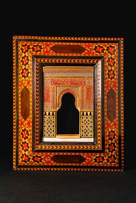ISLAMIC INLAID WOODEN MODEL OF THE ALHAMBRA PALACE. Ca. 19th century AD. A framed architectural 