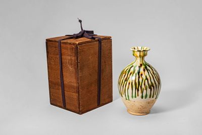 CHINESE SANCAI GLAZED VASE. Tang Dynasty, Ca. 7th-10th century AD or later. A pottery vase of 