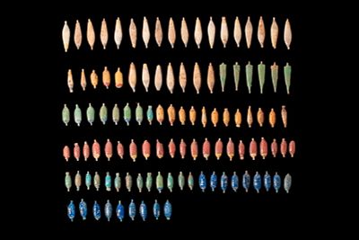 LARGE COLLECTION OF EGYPTIAN POLYCHROME FAIENCE FLORAL AND FOLIATE PENDANT BEADS - EX CHRISTIE'S. 