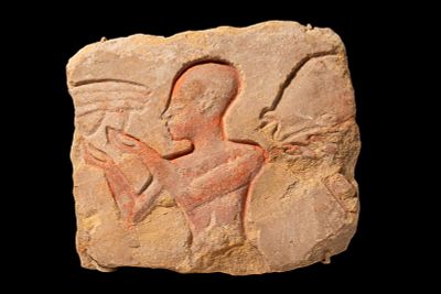 EGYPTIAN SANDSTONE RELIEF WITH WORSHIPPER. Amarna Period, Ca. 1353 - 1336 BC. A sandstone relief 