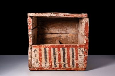 EGYPTIAN PAINTED WOOD USHABTI CASE WITH PAPYRUS FLOWERS. New Kingdom, Ca. 1550 - 1069 BC. A 