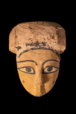 EGYPTIAN WOODEN SARCOPHAGUS MASK. Ptolemaic Period, Ca. 332 - 30 BC A wooden sarcophagus mask 