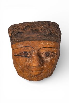 EGYPTIAN PLASTER MUMMY MASK. Late Period, Ca. 664 - 332 BC A plaster mummy mask with elongated 