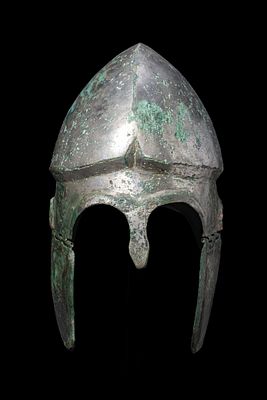 CHALCIDIAN HIGH TIN BRONZE HELMET WITH CHEEKS. Ca. 300 BCA bronze Chalcidian helmet with a domed 