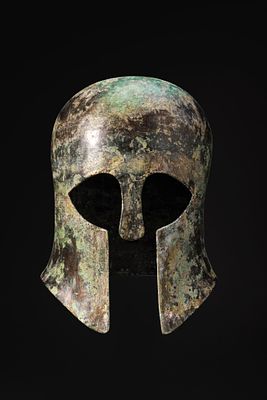 STUNNING CORINTHIAN BRONZE HELMET. Ca. 550 - 450 BCA bronze Corinthian helmet hammered in one 