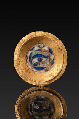 RARE EGYPTIAN HIGH KARAT GOLD PLAQUE WITH STONE INLAID EYE OF HORUS. Ca. 100 BC - AD 100. A 