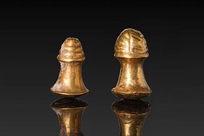 RARE PAIR OF EGYPTIAN HIGH KARAT GOLD EAR PLUGS FOR MUMMY. New Kingdom, Ca. 1550 - 1069 BC. A 