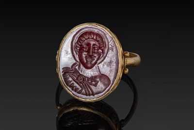 BYZANTINE CARNELIAN INTAGLIO OF A MILITARY SAINT IN HIGH KARAT GOLD RING. Ca. AD 900 - 1200. A 