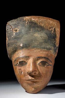 EGYPTIAN PAINTED WOODEN SARCOPHAGUS MASK. Late Period to Ptolemaic Period, Ca. 664 - 30 BC. A 