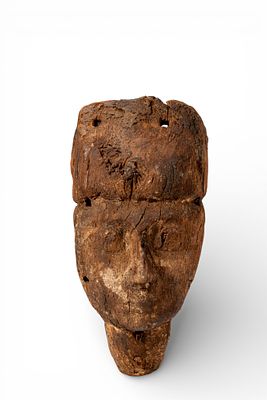 EGYPTIAN WOODEN SARCOPHAGUS MASK. Late Period, Ca. 664 - 332 BC. A wooden sarcophagus mask with 