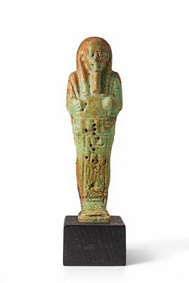 EGYPTIAN FAIENCE USHABTHI WITH INSCRIPTION. Late Period, Ca. 664 - 332 BC. A faience mummiform 