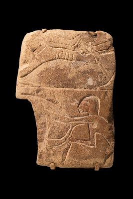 EGYPTIAN SANDSTONE RELIEF OF A DRIVER ON CART. New Kingdom, Ca. 1550 - 1069 BC. A sandstone 