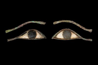 PAIR OF EGYPTIAN EYE INLAYS AND EYEBROWS. Late Period, Ca. 664 - 30 BC. A matching set of mummy 