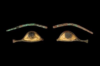 PAIR OF EGYPTIAN EYE INLAYS AND EYEBROWS. Late Period, Ca. 664 - 30 BC. A matching set of mummy 