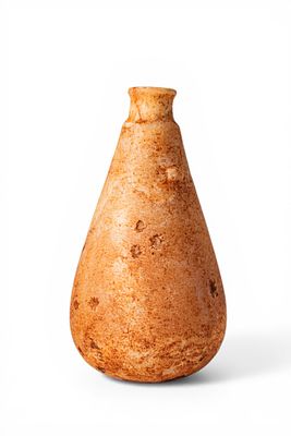 EGYPTIAN ALABASTER BOTTLE. Middle Kingdom, Ca. 2055 - 1790 BC. An alabaster bottle with a 