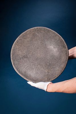 HUGE EGYPTIAN STONE OFFERING BOWL. Early Dynastic, Ca. 2900 - 2640 BC. A speckled stone offering 