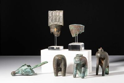 EGYPTIAN BRONZE HEADDRESS AND CROWN GROUP. Late Dynastic Period, Ca. 664 - 332 BC. A group of 