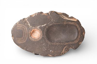 EGYPTIAN HARD STONE PALETTE. Old Kingdom, Ca. 2900 - 2240 BC. An oval-shaped scribe's palette 