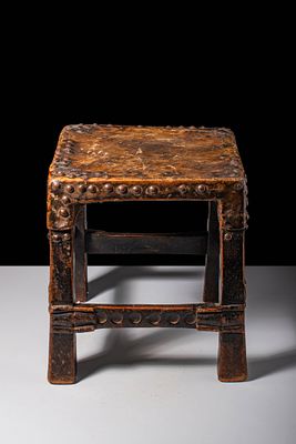CHOKWE STOOL. Ca. late 19th century AD. A prestige stool of square form, the seat covered with 