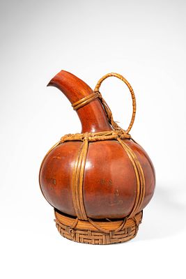 CAMEROON PALM WINE GOURD VESSEL. Ca. 20th century AD. >A palm wine container formed from a large 