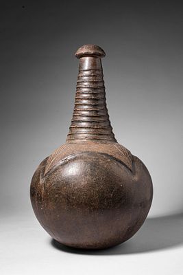 AFRICAN ABARAMBO WATER POT. Ca. 19th - 20th century AD. >A water pot of globular form rising to 
