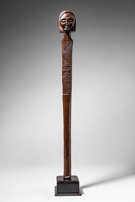 CHOKWE WOODEN STAFF. Angola, Ca. late 19th - early 20th century AD. >A long staff surmounted by 
