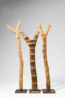 GROUP OF THREE DOGON LADDERS. Ca. 20th century AD. >A group comprising three carved wooden 