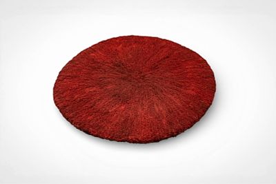 ZULU HEADDRESS. Ca. 20th century AD. >A circular Zulu hat formed from densely arranged natural 