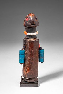 AFRICAN FERTILITY DOLL. Ca. 20th century AD. >A carved wooden figure with a cylindrical body and 