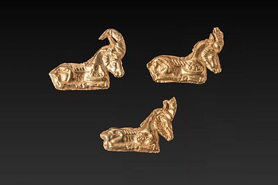 COLLECTION OF GREEK PERIOD HIGH KARAT GOLD IBEX APPLIQUES. Ca. 500 BC. A collection of three 