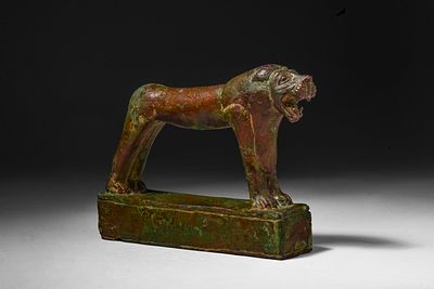 RARE SYRO-EGYPTIAN BRONZE STATUETTE OF A LION. Late Period, Ca. 664 - 332 BC. A bronze statuette 