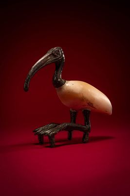 STUNNING EGYPTIAN BRONZE AND STONE FIGURINE OF IBIS. Late Period, Ca. 664 - 525 BC. A composite 