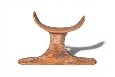 EGYPTIAN WOOD HEADREST. Old Kingdom, Ca. 2707 - 2016 BC. A wood headrest made in two separately 