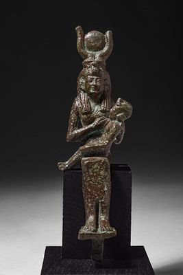 EGYPTIAN BRONZE FIGURINE OF ISIS LACTANS. Late Period to Ptolemaic Period, Ca. 664 - 30 BC. A 