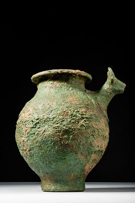 URARTIAN BRONZE JAR WITH BULL HEAD. Ca. 800 - 600 BC. A bronze jar with a projecting bull-head 