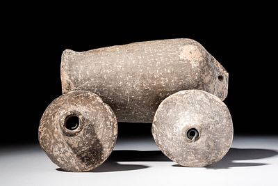 RARE MESOPOTAMIAN TERRACOTTA CART WITH FOUR WHEELS. Ca. 2400 - 2000 BC. A terracotta cart formed 