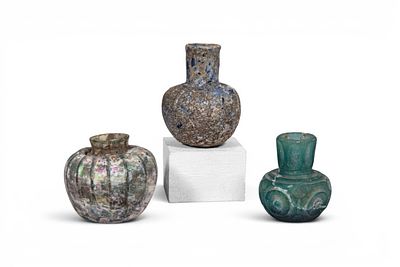 COLLECTION OF UMAYYAD GLASS VESSELS. Ca. AD 800 - 950. A collection of three glass vessels 