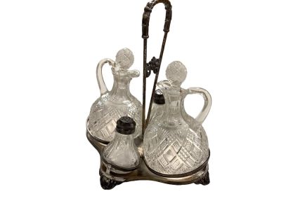 Glass Cruet Set in Quadruple Plate Holder. (4) piece Etched Condiment set. Condition: We have 