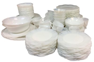 Milk Glass Dinnerware. (138) pieces. Floral design. Unmarked.Shipping Note: $280.00 packing and 