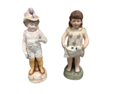 (2) Bisque Figurines. Girl holding puppy dog figurine, signed by Colbert 12&icirc; H base 4&icirc; W.Boy 