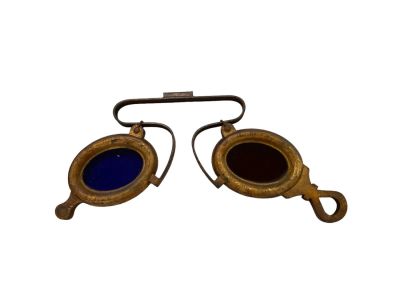 Early Eyeglass Trade Sign Painted cast iron with red and blue glass lenses, L 22.5" x 7&icirc; H. 