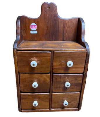 Antique 6-drawer Spice Cabinet Wood with porcelain drawer pulls. Measures 15" tall, 9 1/2" wide 