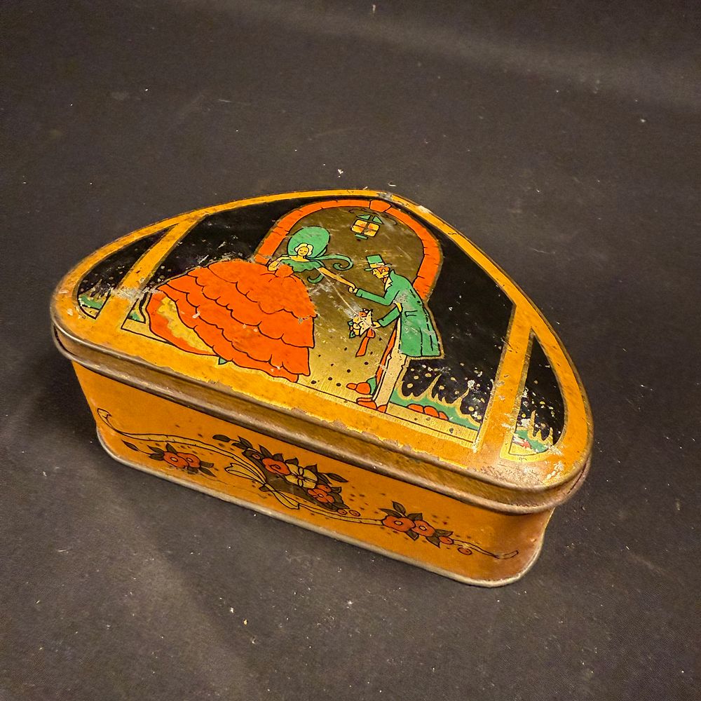 Lot 257: Lyons' Toffee Triangular Metal Advertising Tin