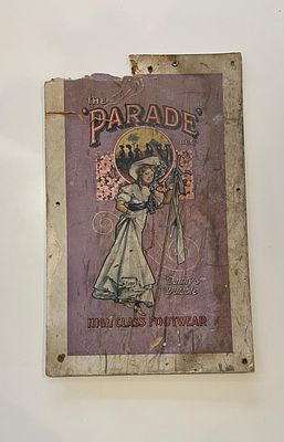 The Parade Lithographed Cardboard Advertising Display Sign. Circular vignette of a fashionable 
