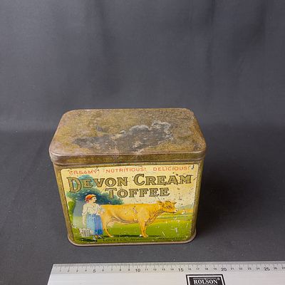 Lovell's Devon Cream Toffee Tin. Aged metal tin for Lovell's Devon Cream Toffee. Pastoral scene 