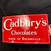 Cadbury's Chocolates Enamel Advertising Sign. Red ground with white lettering and border. Marked Image - 9