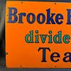 Brooke Bond Dividend Tea Enamel Advertising Sign. Orange background with navy blue serif font Image - 1