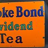 Brooke Bond Dividend Tea Enamel Advertising Sign. Orange background with navy blue serif font Image - 2